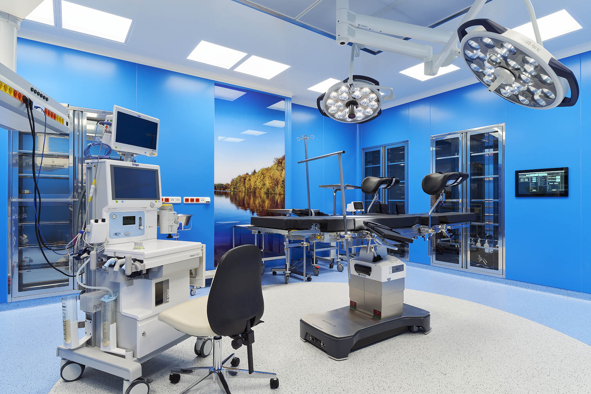 Modern blue operating room with medical equipment